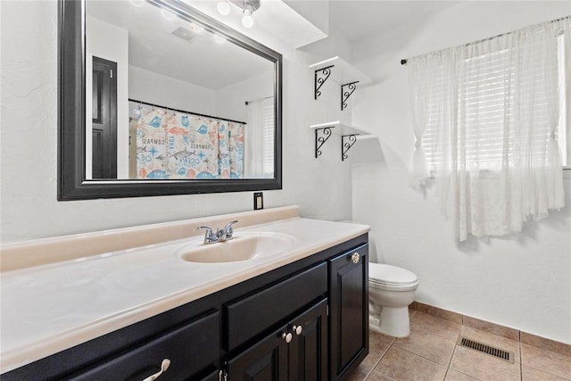 2020 Lyle Rd, Weatherford, OK 73096 - bathroom with vanity, toilet, and tile patterned flooring