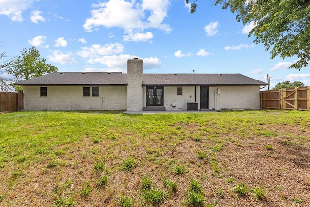2020 Lyle Rd, Weatherford, OK 73096 - back of property featuring cooling unit, a patio area, and a chimney