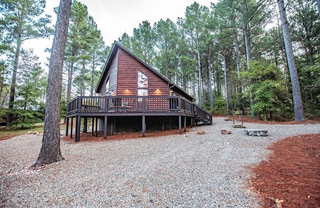 56 Muscadine Trl, Broken Bow, OK 74728 - view of front of home featuring a wooden deck and faux log siding