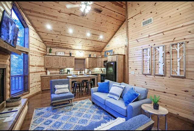 56 Muscadine Trl, Broken Bow, OK 74728 - living area with high vaulted ceiling, wood walls, wooden ceiling, ceiling fan, and recessed lighting