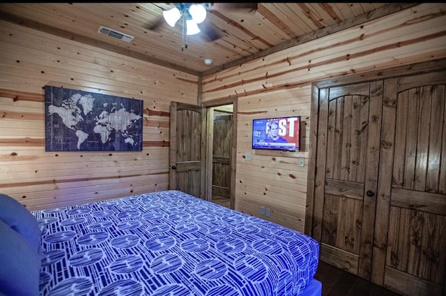 56 Muscadine Trl, Broken Bow, OK 74728 - bedroom featuring wood walls, wood ceiling, ceiling fan, and wood finished floors