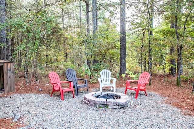 56 Muscadine Trl, Broken Bow, OK 74728 - view of patio with an outdoor fire pit