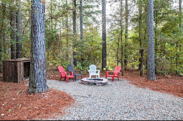 56 Muscadine Trl, Broken Bow, OK 74728 - view of patio / terrace with a fire pit