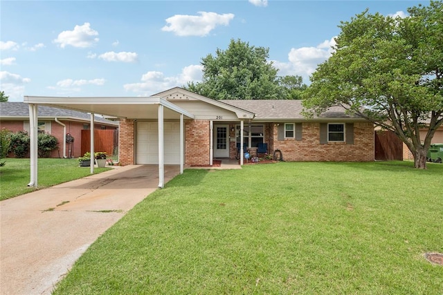 201 Vine St, Yukon, OK 73099 - ranch-style house with brick siding, concrete driveway, a garage, and a carport