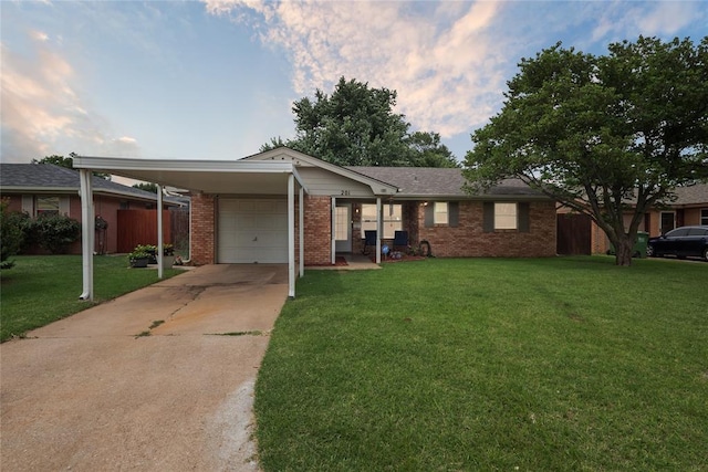 201 Vine St, Yukon, OK 73099 - ranch-style house with concrete driveway, brick siding, an attached garage, and an attached carport