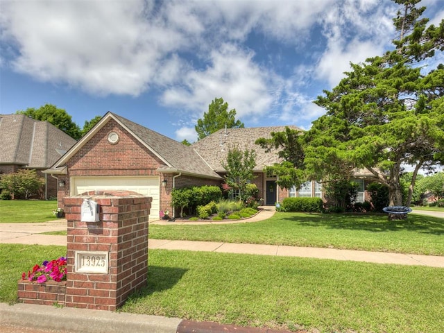 13925 Middleberry Rd, Edmond, OK 73013 - view of front of house featuring a front yard, brick siding, a garage, and driveway