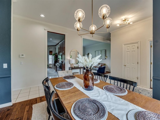 13925 Middleberry Rd, Edmond, OK 73013 - dining area featuring crown molding, a chandelier, wood finished floors, and baseboards