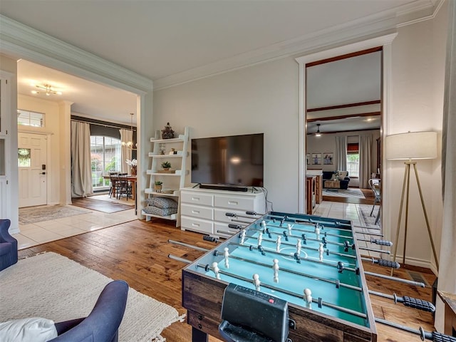 13925 Middleberry Rd, Edmond, OK 73013 - living area with crown molding, wood-type flooring, and a chandelier