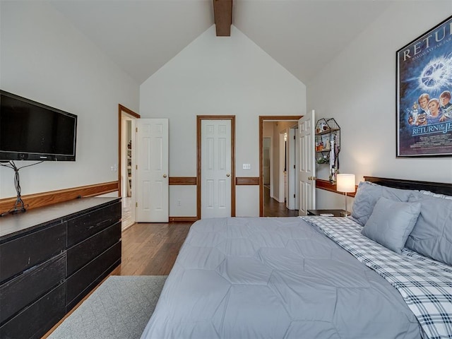 13925 Middleberry Rd, Edmond, OK 73013 - bedroom with wood finished floors, high vaulted ceiling, and beamed ceiling