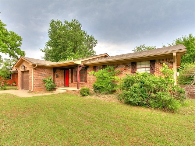 1545 N Pennsylvania Ave, Shawnee, OK 74804 - ranch-style home with brick siding, an attached garage, a front lawn, and a porch