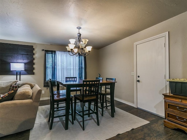 1545 N Pennsylvania Ave, Shawnee, OK 74804 - dining area featuring a chandelier, wood finished floors, and baseboards