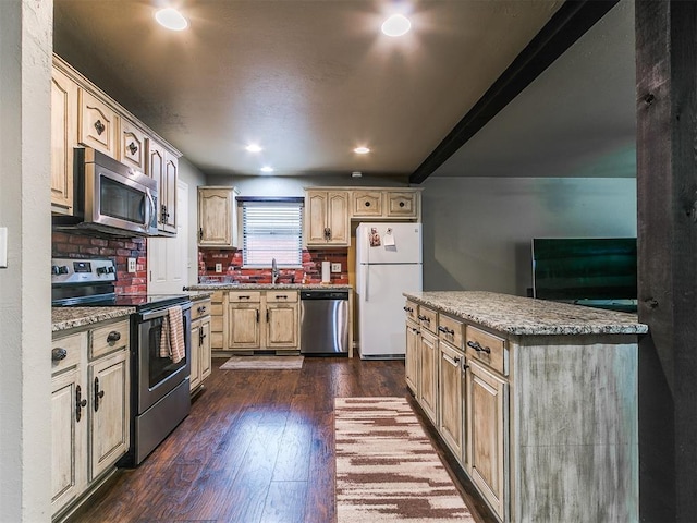 1545 N Pennsylvania Ave, Shawnee, OK 74804 - kitchen featuring appliances with stainless steel finishes, a sink, dark wood finished floors, recessed lighting, and light brown cabinetry