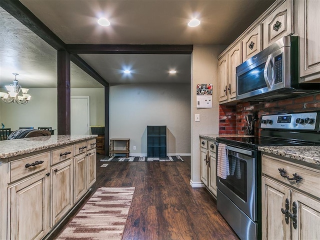 1545 N Pennsylvania Ave, Shawnee, OK 74804 - kitchen featuring stainless steel appliances, dark wood-type flooring, light stone counters, a chandelier, and light brown cabinetry