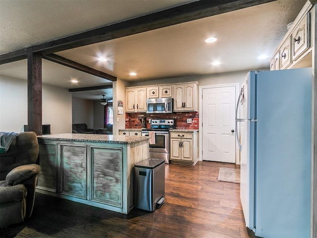 1545 N Pennsylvania Ave, Shawnee, OK 74804 - kitchen with appliances with stainless steel finishes, recessed lighting, dark wood-type flooring, a ceiling fan, and backsplash