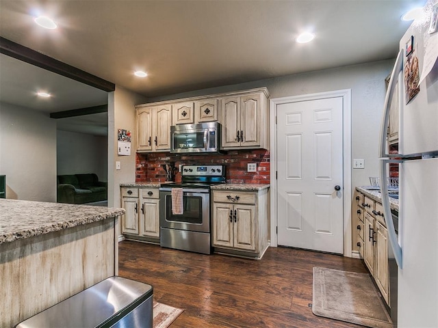 1545 N Pennsylvania Ave, Shawnee, OK 74804 - kitchen with stainless steel appliances, dark wood-style flooring, recessed lighting, decorative backsplash, and light stone counters
