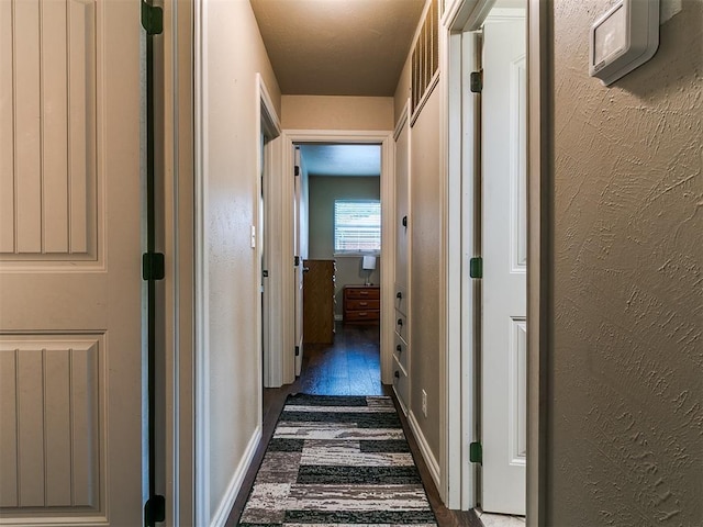 1545 N Pennsylvania Ave, Shawnee, OK 74804 - hallway with wood finished floors and a textured wall