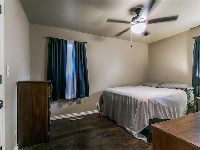 1545 N Pennsylvania Ave, Shawnee, OK 74804 - bedroom featuring dark wood-style flooring, baseboards, and ceiling fan