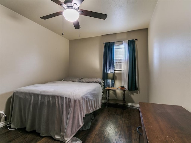 1545 N Pennsylvania Ave, Shawnee, OK 74804 - bedroom with dark wood finished floors, baseboards, and a ceiling fan