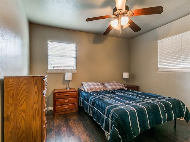 1545 N Pennsylvania Ave, Shawnee, OK 74804 - bedroom with dark wood-type flooring and ceiling fan