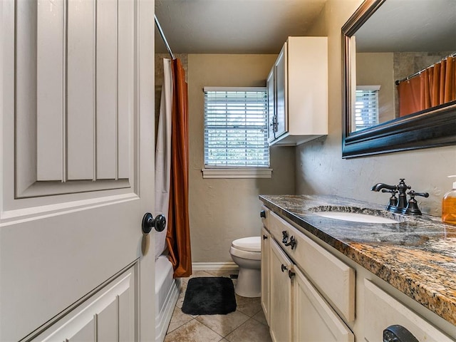 1545 N Pennsylvania Ave, Shawnee, OK 74804 - full bathroom featuring vanity, toilet, tile patterned flooring, shower / bath combo, and baseboards