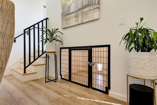 571 S Fretz Ave, Edmond, OK 73003 - entrance foyer with wood finished floors, baseboards, stairway, and a towering ceiling
