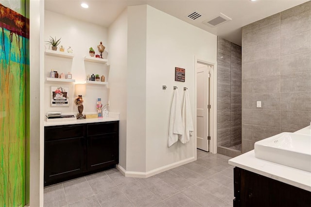 571 S Fretz Ave, Edmond, OK 73003 - full bathroom featuring vanity, tile patterned flooring, baseboards, and recessed lighting