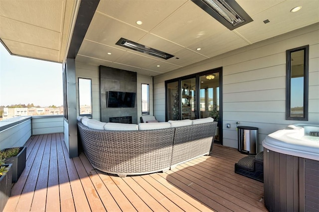 571 S Fretz Ave, Edmond, OK 73003 - wooden deck featuring a hot tub and outdoor lounge area