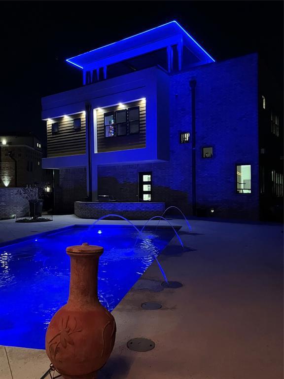571 S Fretz Ave, Edmond, OK 73003 - pool at twilight featuring an outdoor pool and a patio