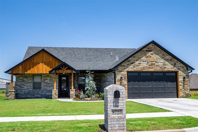 8725 NW Kensington Pl, Lawton, OK 73505 - view of front facade featuring a front lawn, driveway, a garage, a shingled roof, and stone siding