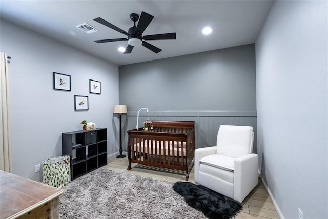 8725 NW Kensington Pl, Lawton, OK 73505 - bedroom with a ceiling fan, a crib, recessed lighting, and baseboards