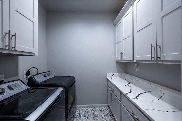 8725 NW Kensington Pl, Lawton, OK 73505 - washroom featuring cabinet space, washer and dryer, and baseboards