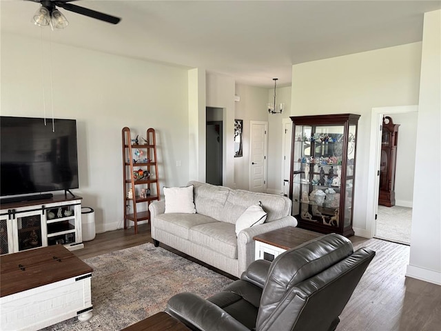 2320 Dixie Dr, Blanchard, OK 73010 - living room with ceiling fan, wood finished floors, baseboards, and a chandelier