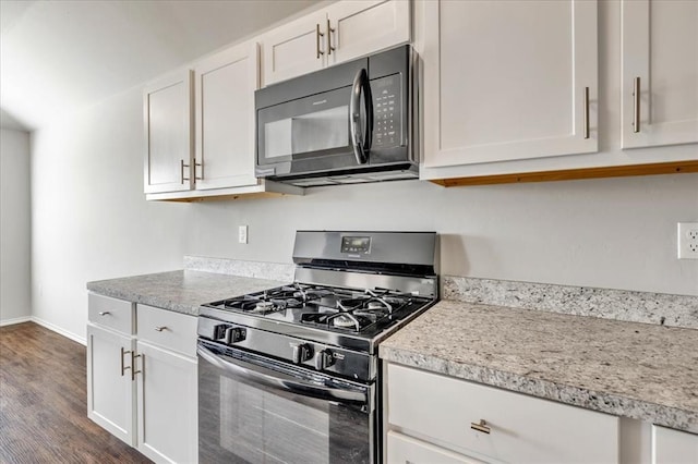 9912 Ruger Rd, Yukon, OK 73099 - kitchen featuring black appliances, white cabinetry, dark wood-type flooring, and light countertops