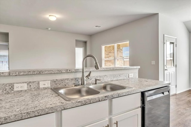 9912 Ruger Rd, Yukon, OK 73099 - kitchen with dishwasher, a sink, light countertops, white cabinetry, and wood finished floors