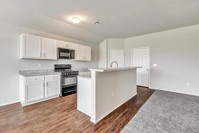 9912 Ruger Rd, Yukon, OK 73099 - kitchen featuring black appliances, white cabinetry, a kitchen island with sink, dark wood-type flooring, and a sink