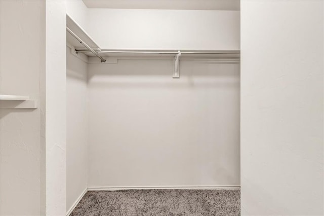9912 Ruger Rd, Yukon, OK 73099 - spacious closet featuring carpet floors