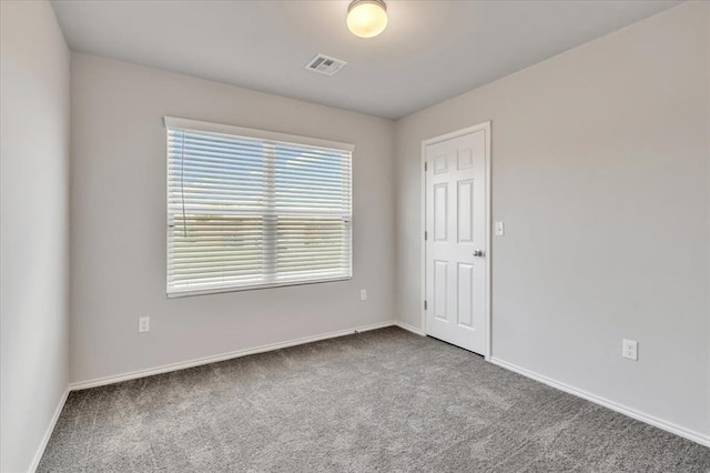 9912 Ruger Rd, Yukon, OK 73099 - carpeted spare room featuring baseboards