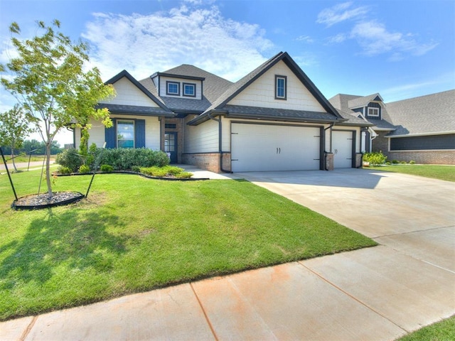 3317 Open Prairie Trl, Yukon, OK 73099 - craftsman-style home featuring an attached garage, driveway, a front lawn, and brick siding