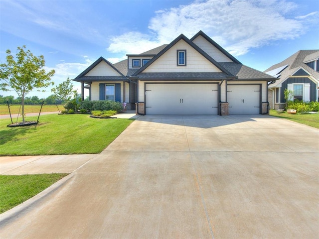 3317 Open Prairie Trl, Yukon, OK 73099 - craftsman inspired home featuring a garage, a front yard, driveway, and a shingled roof