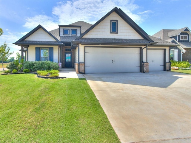 3317 Open Prairie Trl, Yukon, OK 73099 - craftsman-style house featuring a garage, concrete driveway, a front lawn, and a shingled roof