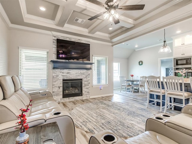 3317 Open Prairie Trl, Yukon, OK 73099 - living area featuring crown molding, a ceiling fan, wood finished floors, a fireplace, and recessed lighting