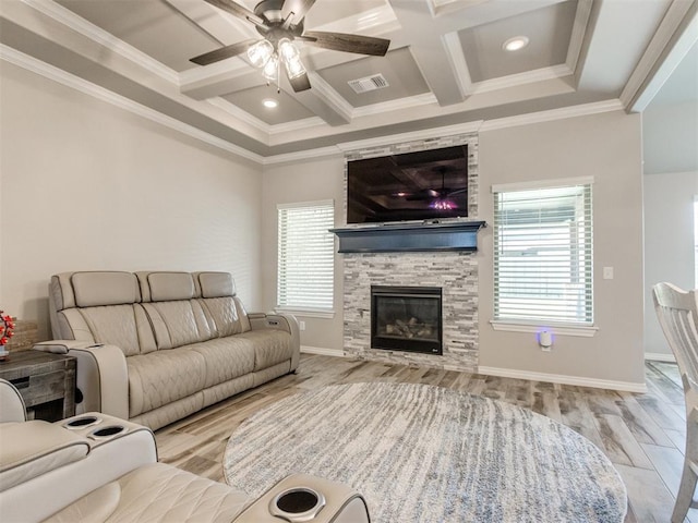 3317 Open Prairie Trl, Yukon, OK 73099 - living area with coffered ceiling, a stone fireplace, ornamental molding, beam ceiling, and ceiling fan