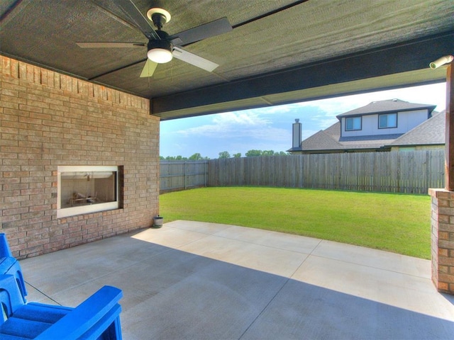 3317 Open Prairie Trl, Yukon, OK 73099 - view of patio with ceiling fan and an outdoor brick fireplace