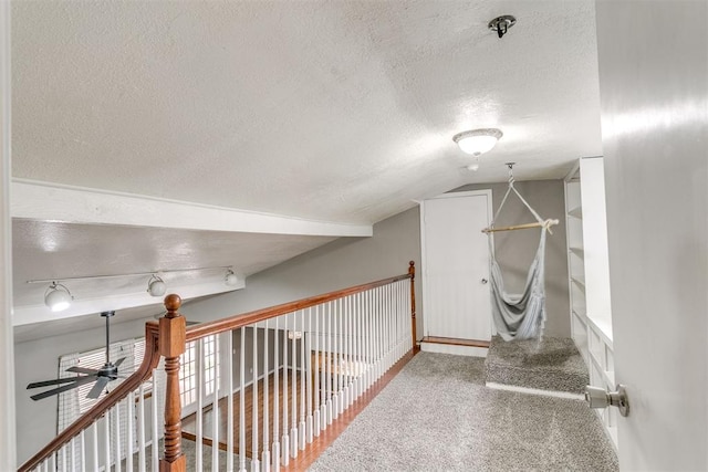 816 Woodbury Dr, Edmond, OK 73034 - corridor with a textured ceiling, vaulted ceiling, and carpet flooring