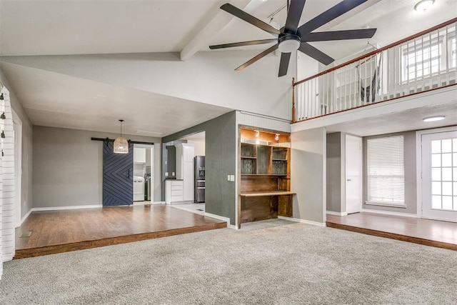 816 Woodbury Dr, Edmond, OK 73034 - unfurnished living room featuring carpet flooring, high vaulted ceiling, a ceiling fan, and beamed ceiling