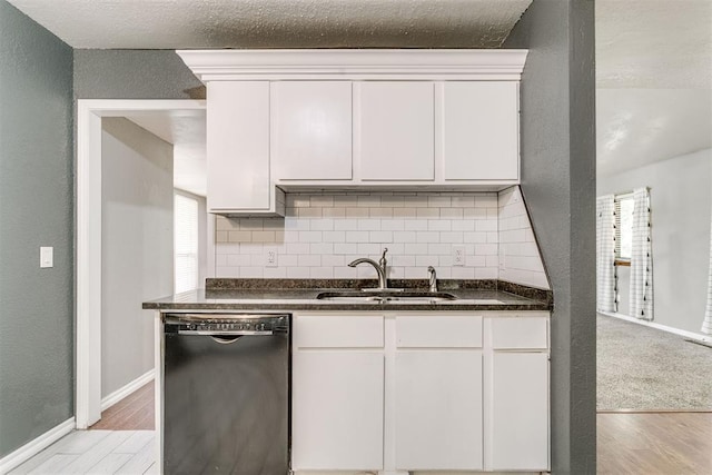 816 Woodbury Dr, Edmond, OK 73034 - kitchen featuring black dishwasher, light wood-type flooring, tasteful backsplash, white cabinetry, and plenty of natural light