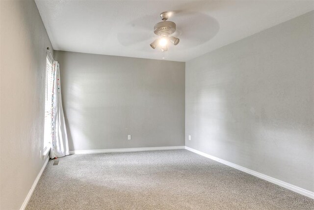 816 Woodbury Dr, Edmond, OK 73034 - carpeted empty room featuring ceiling fan and baseboards