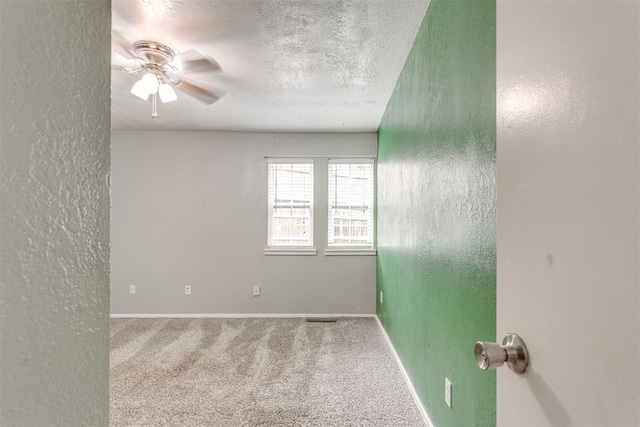 816 Woodbury Dr, Edmond, OK 73034 - unfurnished room with carpet flooring, ceiling fan, a textured ceiling, and a textured wall