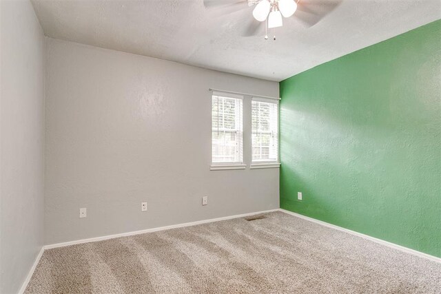 816 Woodbury Dr, Edmond, OK 73034 - carpeted spare room with a ceiling fan and a textured wall