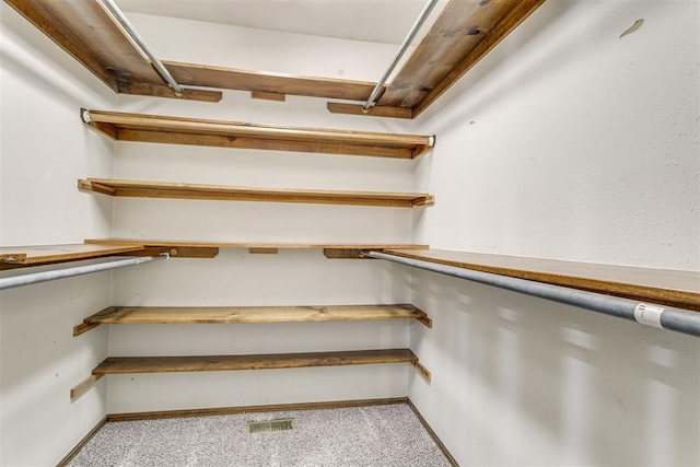 816 Woodbury Dr, Edmond, OK 73034 - spacious closet with light colored carpet